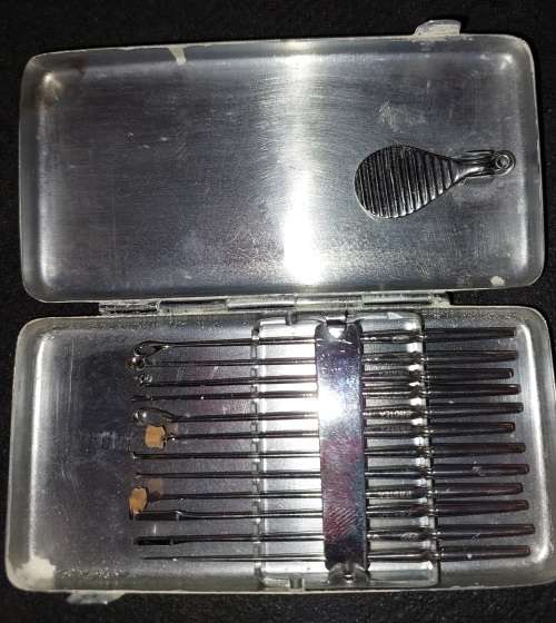 A VINTAGE STAINLESS STEEL SET EAR WAX REMOVER MADE IN GERMANY