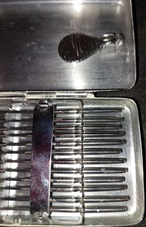 A VINTAGE STAINLESS STEEL SET EAR WAX REMOVER MADE IN GERMANY