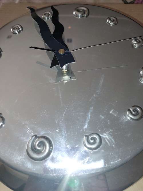 A beautiful virtually brand new Carol Boyes style aluminum alloy clock 32 centimeters diameter