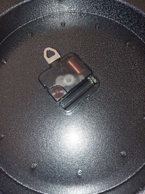 A beautiful virtually brand new Carol Boyes style aluminum alloy clock 32 centimeters diameter