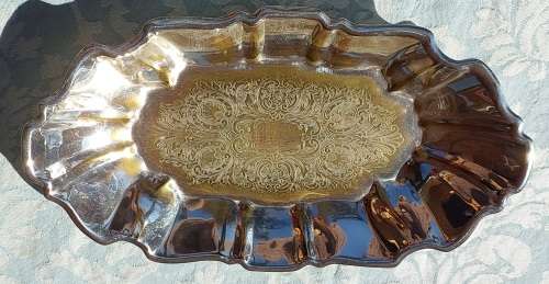 AN OVAL ART DECOR SILVER PLATED ON BRASS SERVING TRAY