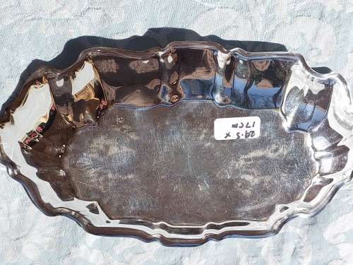 AN OVAL ART DECOR SILVER PLATED ON BRASS SERVING TRAY