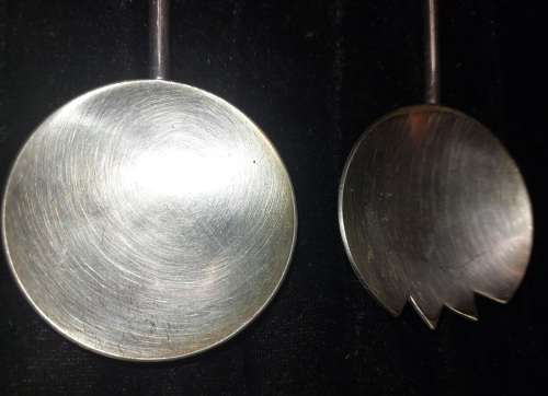 A PAIR STAINLESS STEEL SALAD LADELS SOLD AS IS