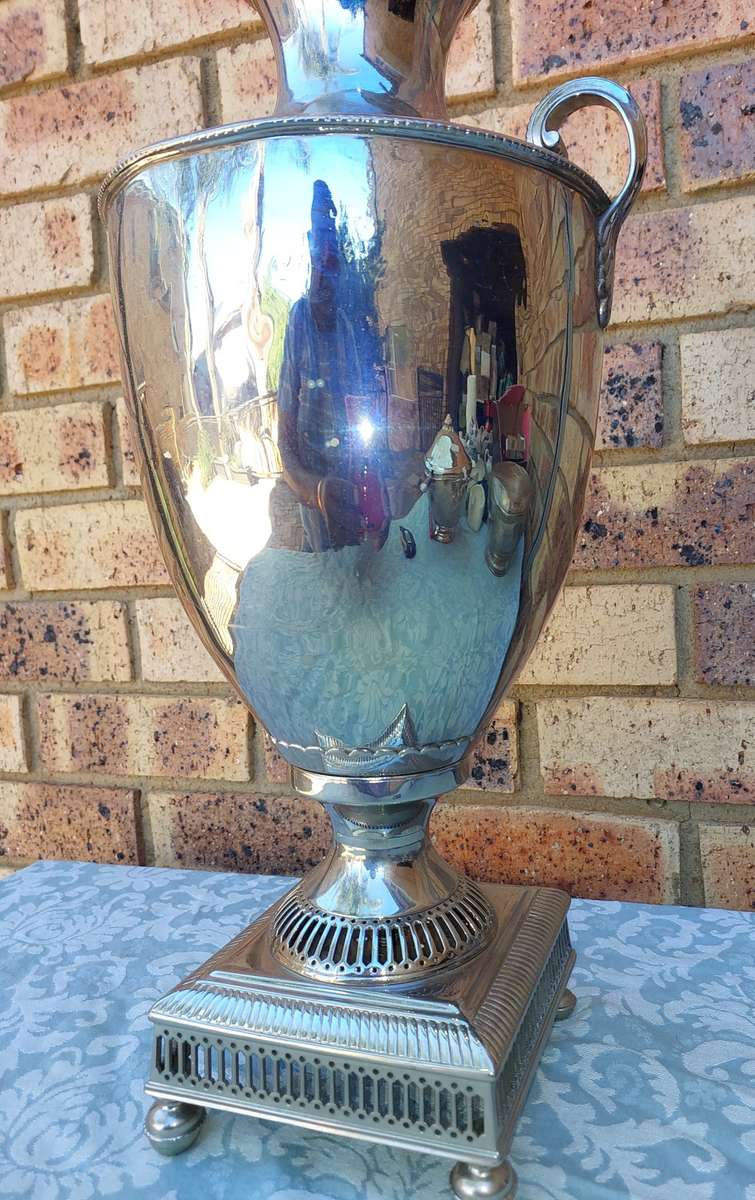 A VINTAGE SILVERPLATED 50-CENTIMETER HIGH ROMAN-STYLE VASE