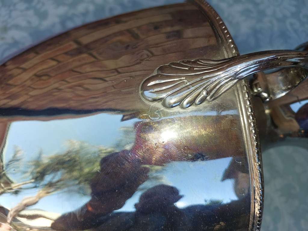 A VINTAGE SILVERPLATED 50-CENTIMETER HIGH ROMAN-STYLE VASE