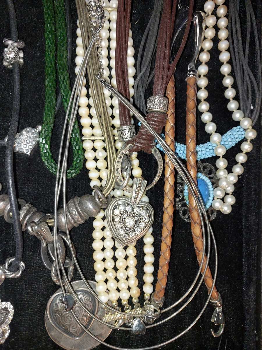 A COLLECTION OF VINTAGE COSTUME NECKLACES SOLD AS IS
