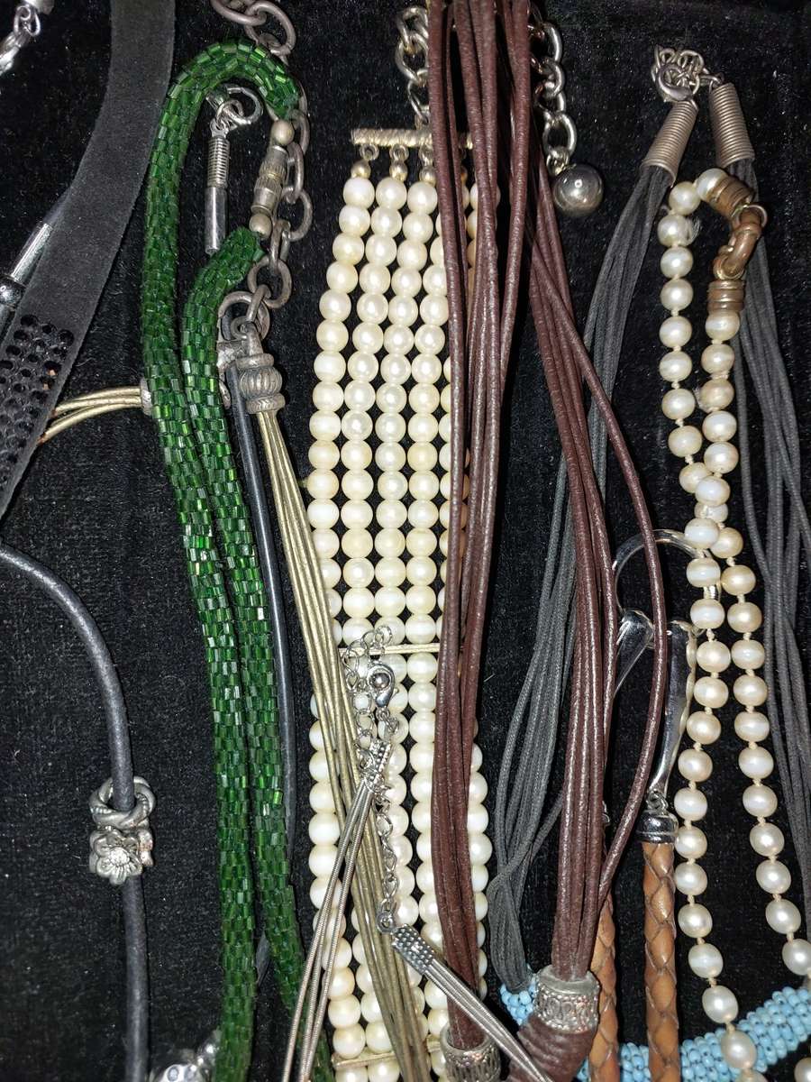 A COLLECTION OF VINTAGE COSTUME NECKLACES SOLD AS IS