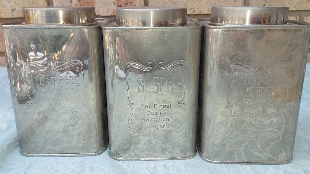 A SILVER PLATED ART DECOR SET OF CONTAINERS