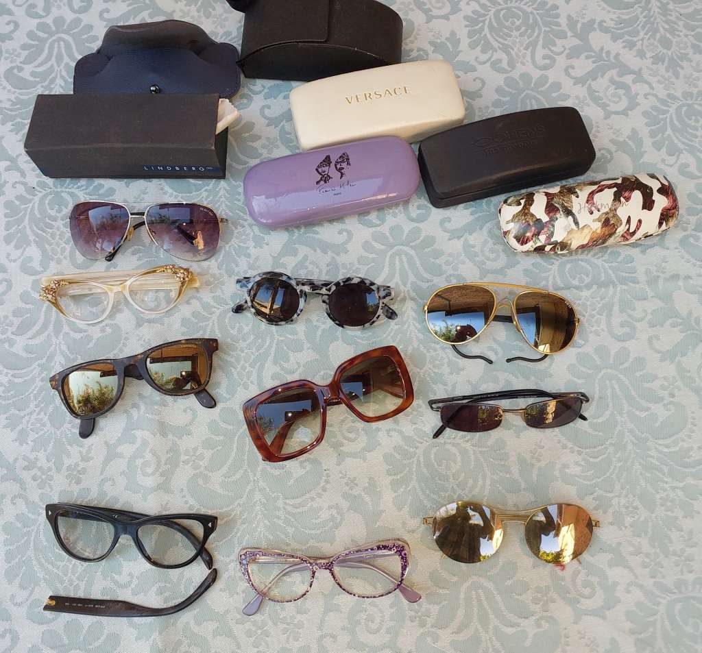 A COLLECTION OF VINTAGE SPECTACLES AND CASES