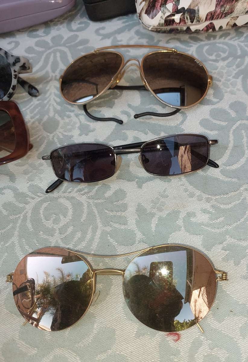 A COLLECTION OF VINTAGE SPECTACLES AND CASES