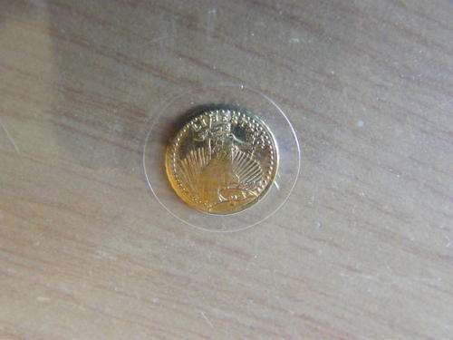 A VERY SMALL UNITED STATES LIBERTY GOLD COIN SEALED IN A SLEEVE. STARTING @ CRAZY R1