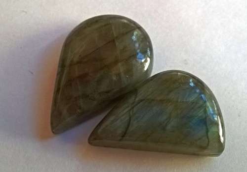 Labradorite pear and fancy cut cabs two pieces 25 ct and 21ct around 9 grams in total