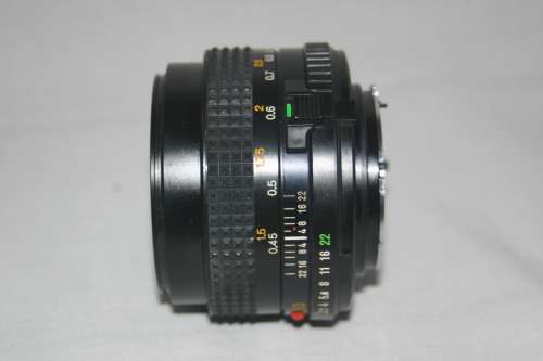 MINOLTA  MD  50 mm  1:2.   49 mm dia. FILM CAMERA LENSE.