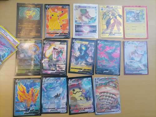 104 POKEMON TRADING CARDS AND 2 X COLLECTABLE POKEMON TINS