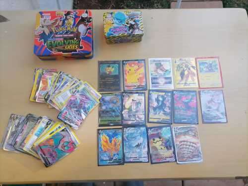 104 POKEMON TRADING CARDS AND 2 X COLLECTABLE POKEMON TINS