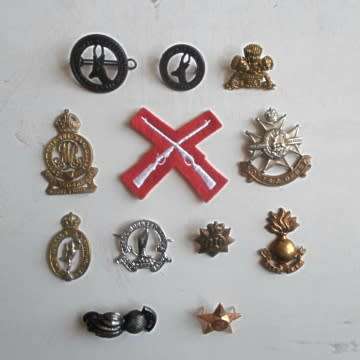 A Selection Of Badges Selling As A Lot