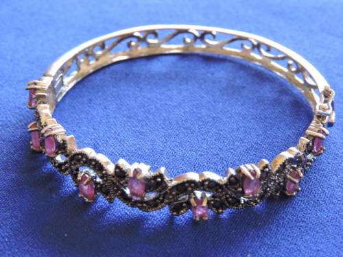 RUBY and SILVER HINGED BANGLE WITH 9 NATURAL RUBIES AND MARCASITE