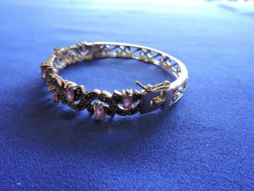 RUBY and SILVER HINGED BANGLE WITH 9 NATURAL RUBIES AND MARCASITE