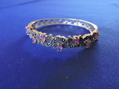 RUBY and SILVER HINGED BANGLE WITH 9 NATURAL RUBIES AND MARCASITE
