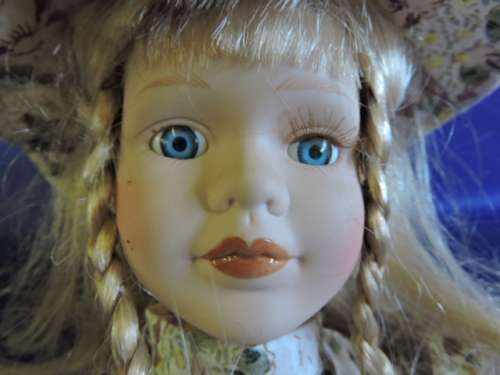 Vintage Porcelain Doll (Plated pony tails)