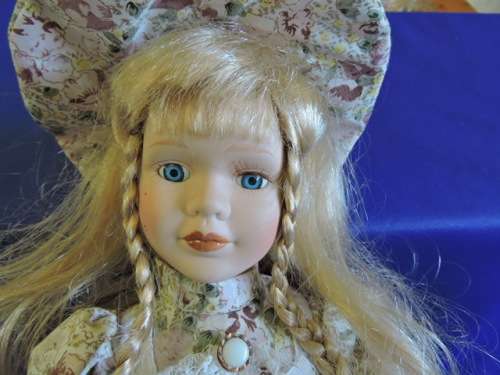 Vintage Porcelain Doll (Plated pony tails)