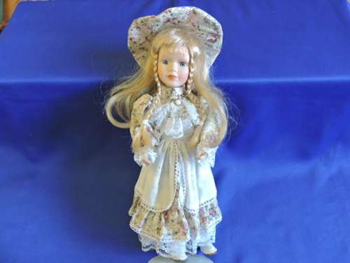 Vintage Porcelain Doll (Plated pony tails)