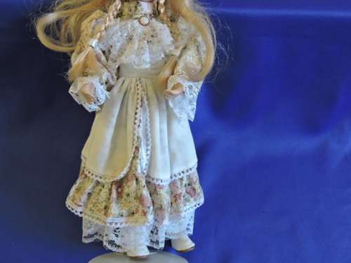 Vintage Porcelain Doll (Plated pony tails)