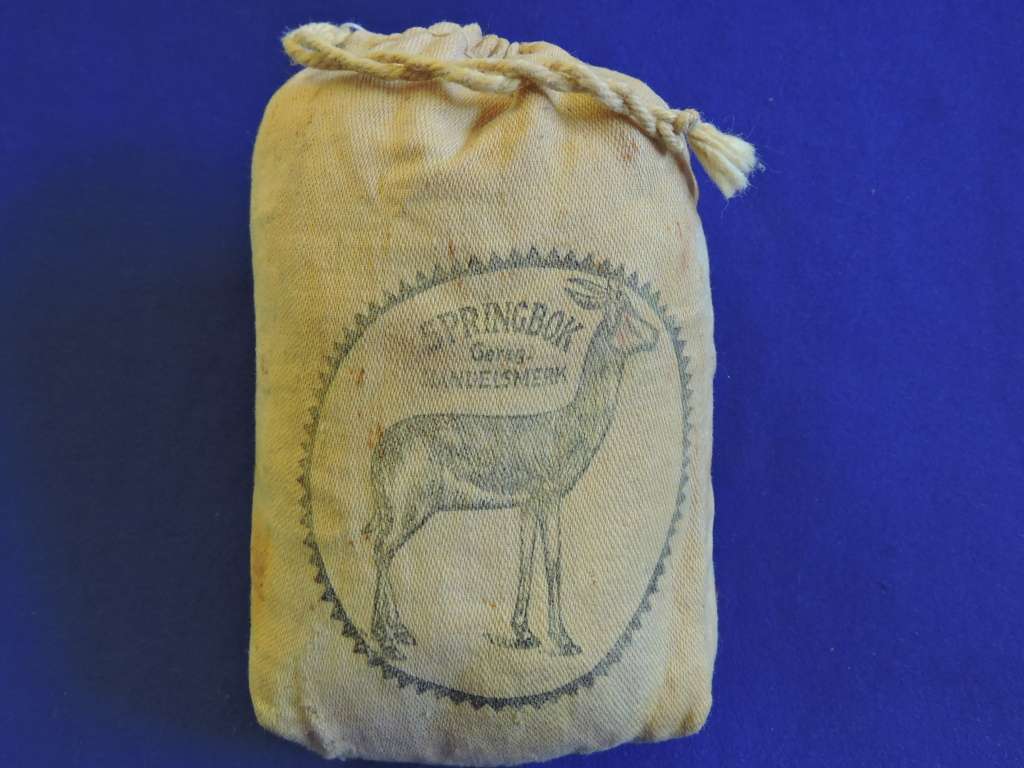 Vintage smoking pipe with Springbok tabak sak and leather tobacco pouch.