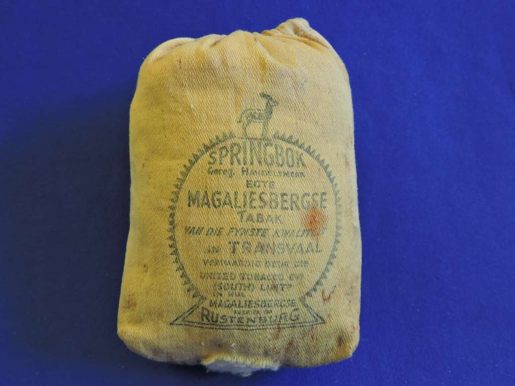 Vintage smoking pipe with Springbok tabak sak and leather tobacco pouch.