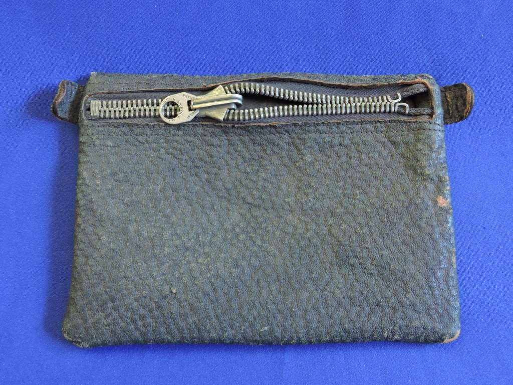 Vintage smoking pipe with Springbok tabak sak and leather tobacco pouch.