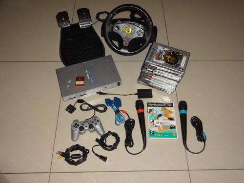 PLAYSTATION 2 CONSOLE + STEERING WHEEL + SINGSTAR + 12 GAMES AND MORE!!!