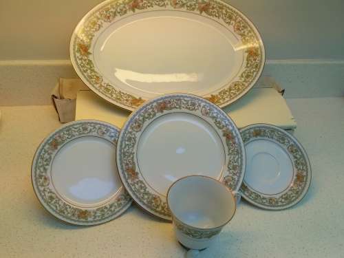 Noritake complete 12 place settings.Teresa pattern.Platter, sauce boat.