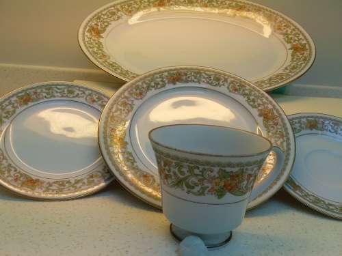 Noritake complete 12 place settings.Teresa pattern.Platter, sauce boat.