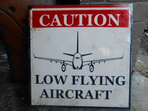 low flying aircraft metal sign