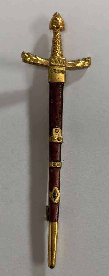 A Miniature Sword pendant.