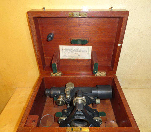 Theodolite in wooden box for sale.