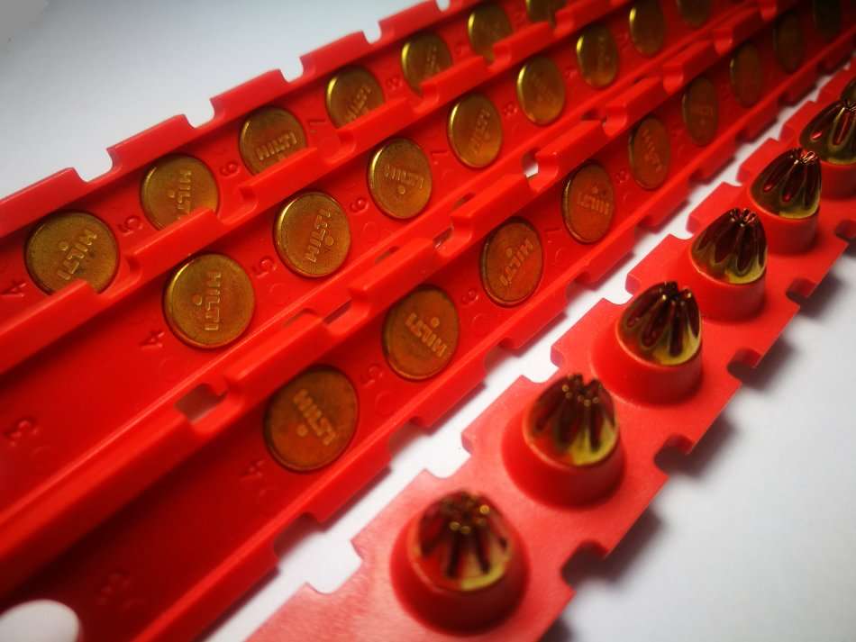 STRIP OF 10 RED HILTI CAPS. (.27 CAL SHORT). CAN BE USED FOR TRIP WIRE BANG REFILLS.