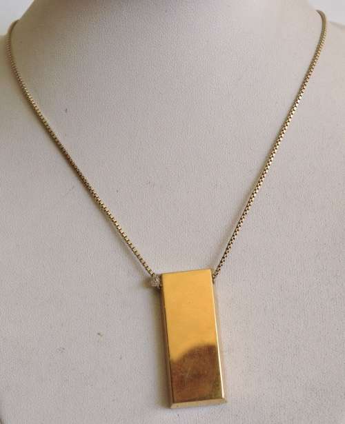 The Gold Bullion Collection 22 carat gold plated bar pendant and chain designed by Royston Lamond