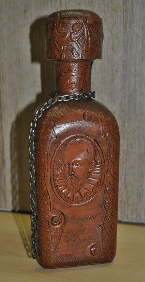 Vintage Miguel de Cervantes embossed Leather wrapped liquor bottle/decanter. Hand-made in Spain