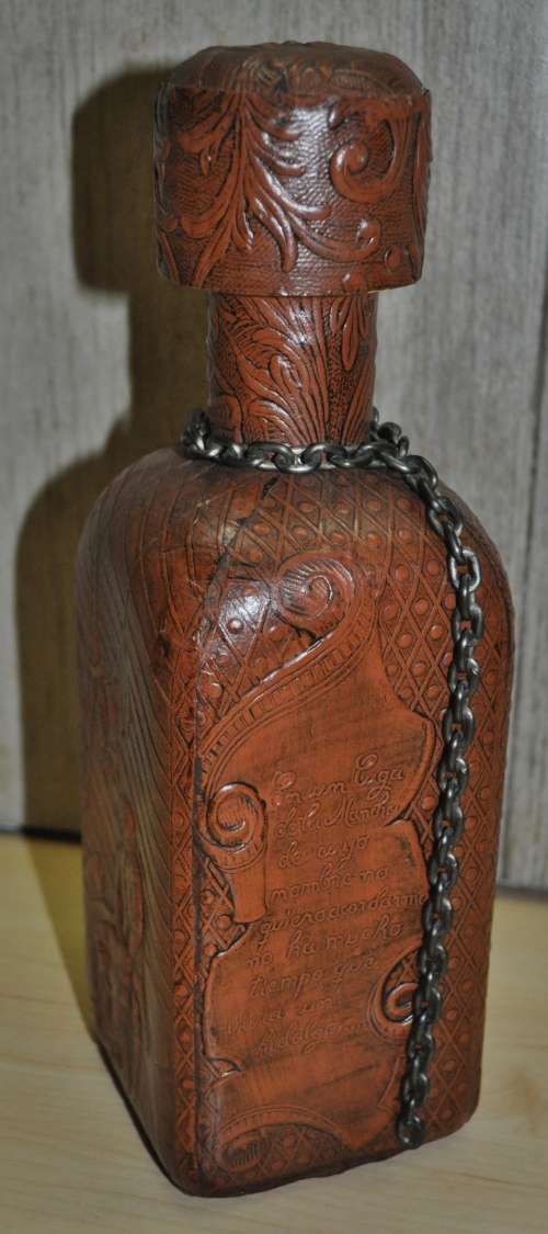 Vintage Miguel de Cervantes embossed Leather wrapped liquor bottle/decanter. Hand-made in Spain