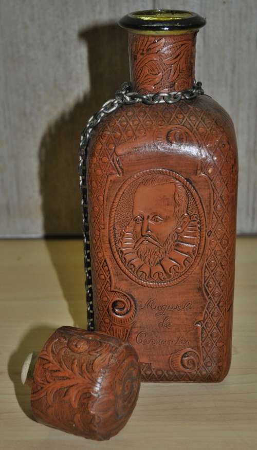 Vintage Miguel de Cervantes embossed Leather wrapped liquor bottle/decanter. Hand-made in Spain