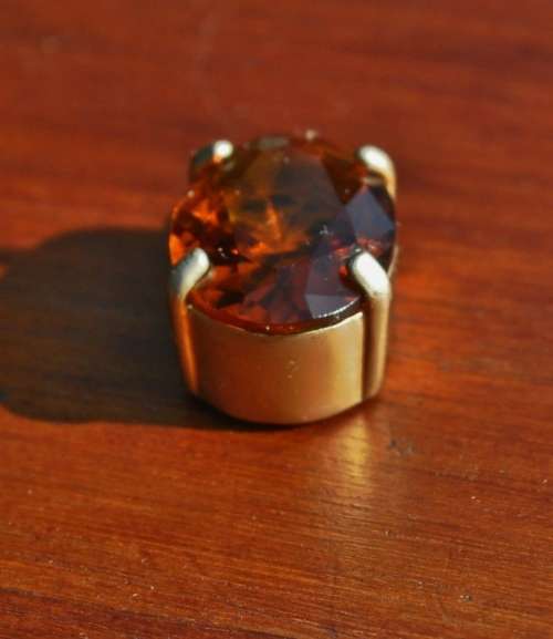 Vintage 1950s Faceted Oval Amber Glass Crystal prong set pendant in hand pierced gold tone mount