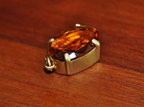 Vintage 1950s Faceted Oval Amber Glass Crystal prong set pendant in hand pierced gold tone mount