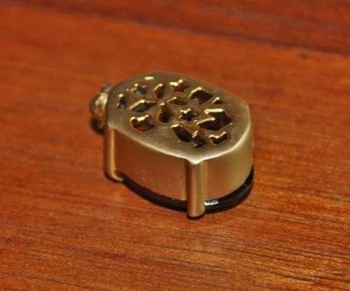 Vintage 1950s Faceted Oval Amber Glass Crystal prong set pendant in hand pierced gold tone mount