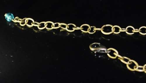 Vintage brass costume jewellery necklace with green and clear crystal