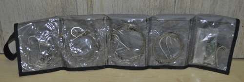 Kingfisher Sail Pouch with variety of traces, Mustad hooks, a Lure, Lead sinkers, and more