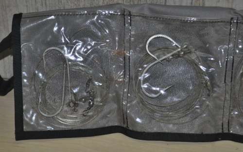 Kingfisher Sail Pouch with variety of traces, Mustad hooks, a Lure, Lead sinkers, and more