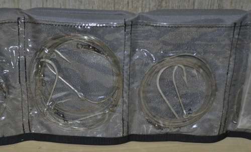 Kingfisher Sail Pouch with variety of traces, Mustad hooks, a Lure, Lead sinkers, and more