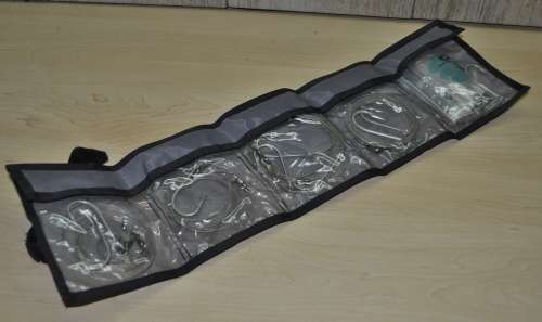 Kingfisher Sail Pouch with variety of traces, Mustad hooks, a Lure, Lead sinkers, and more