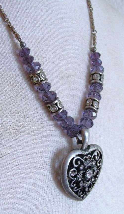Vintage silver tone heart pendant necklace with clear and purple faceted crystal